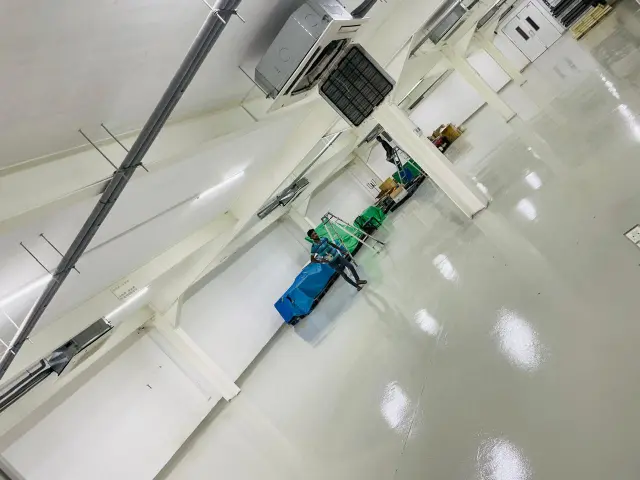 Qualitair technician servicing multi-split air conditioner